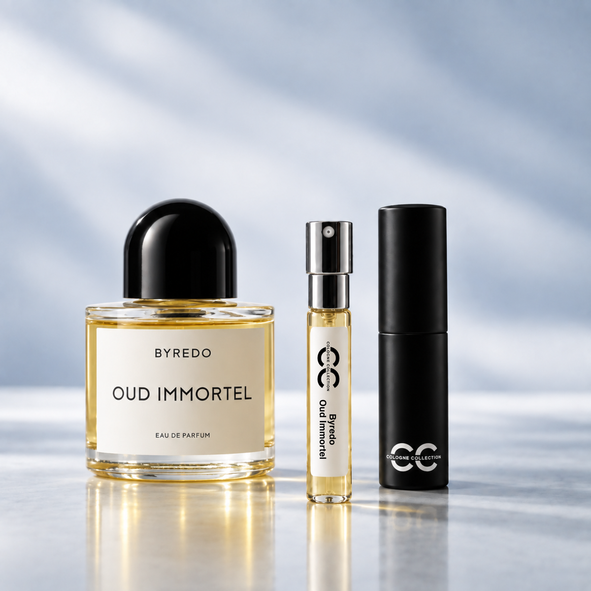 Byredo Oud Immortel perfume bottle with 10ml fragrance sample and Cologne Collection travel atomiser